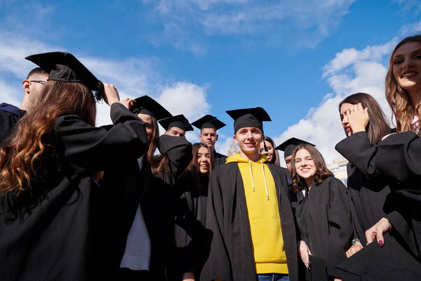 Group of diverse international graduating students celebrating - Fotoğraf, Görsel