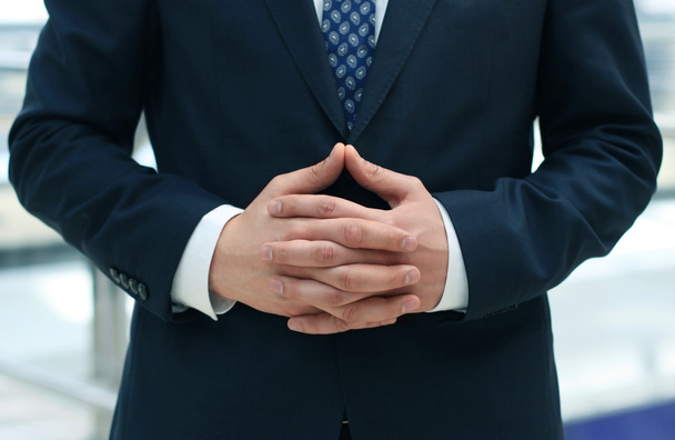 Businessman waiting with folded hands - Photo, Image