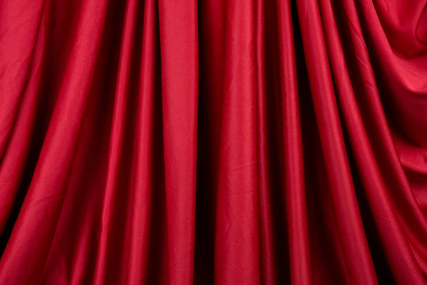 Texture, background, template. Silk fabric. Red silk drapery and upholstery fabric. Solid fabrics for backdrop, drapes, flags and curtains - Фото, зображення