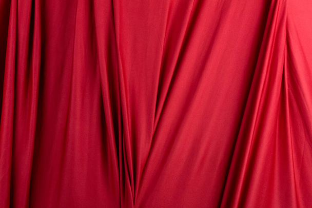 Texture, background, template. Silk fabric. Red silk drapery and upholstery fabric. Solid fabrics for backdrop, drapes, flags and curtains - Фото, зображення