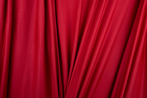 Texture, background, template. Silk fabric. Red silk drapery and upholstery fabric. Solid fabrics for backdrop, drapes, flags and curtains - Fotoğraf, Görsel