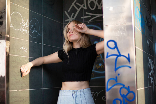 Blond hair white young woman in skirt underground style - 写真・画像