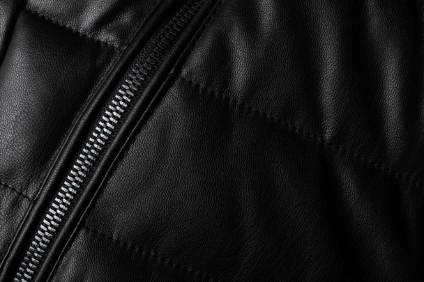 Black leather texture closeup as background. Jacket leather fabric texture. - Photo, Image