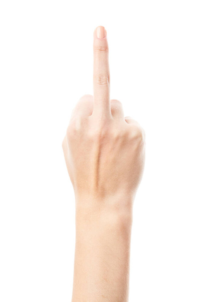 Middle finger. Woman showing her aggressiveness and discontent. Woman hand showing middle finger on a white isolated background - Photo, Image