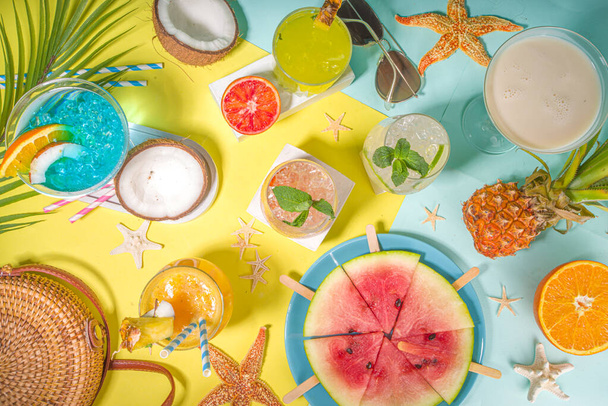 Summer holiday bar and snack concept, picnic background, Fresh watermelon slices with ice cream sticks, various alcohol cocktails and drinks, seashells and summertime accessories, flatlay top view - Photo, Image