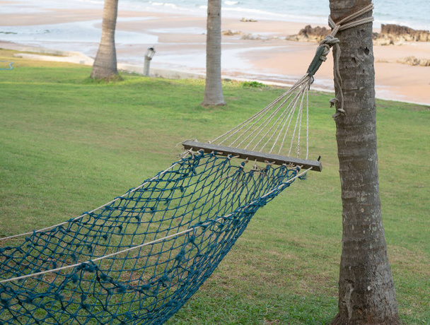 Tourist hammock for relaxing on the beach. Hammock for outdoor holiday recreation. - Photo, image