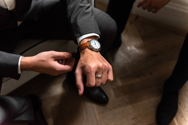 Men's accessories, butterfly on the neck, watch on the hands, men's shoes. Groom. - Photo, Image