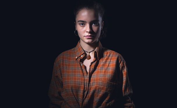 portrait of a beautiful teenage girl with orange plaid shirt - Foto, imagen