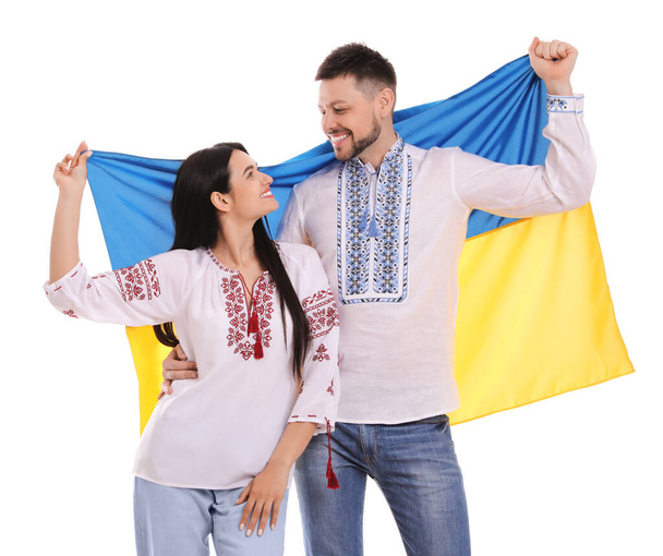 Happy couple with flag of Ukraine on white background - Photo, image