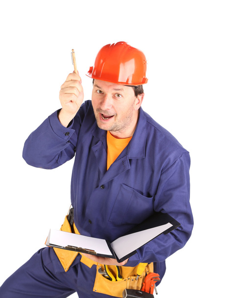 Worker in hard hat with pen. - Photo, image