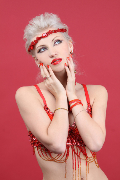 Beautiful fashion model in red looking up - Foto, imagen