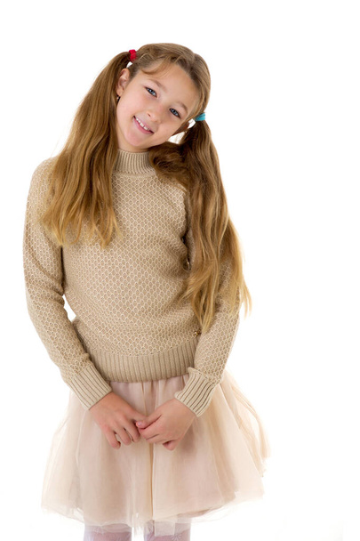 Thoughtful preteen girl. Posing against white background. - Photo, Image
