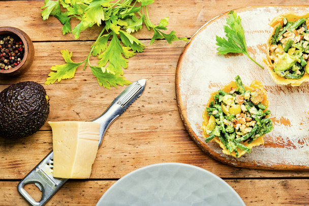 Appetizing cheese basket with avocado,cowpea and nuts.Banquet,holiday food - Photo, Image