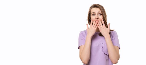 CanT Say Anything. Shocked young woman covering her mouth with hands, isolated on white background - Photo, Image