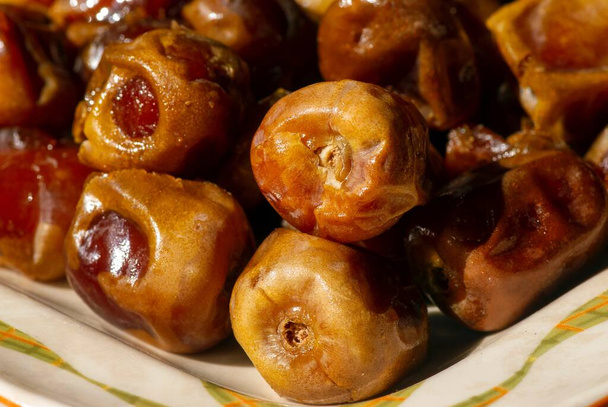 Close up of sweet sukkari dates fruit (Kurma Sukkari) from Saudi Arabia ready to ramadan - Foto, imagen