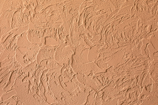 Structure of decorative plaster. Brown background and texture of decorative plaster to cover the walls and ceilings. Copy space - Φωτογραφία, εικόνα