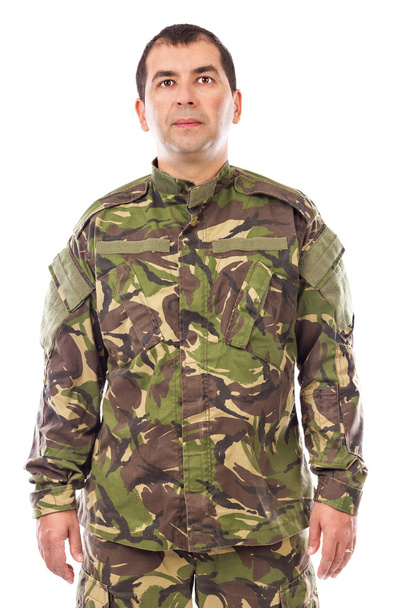 Portrait of a young soldier looking at camera isolated - Photo, Image