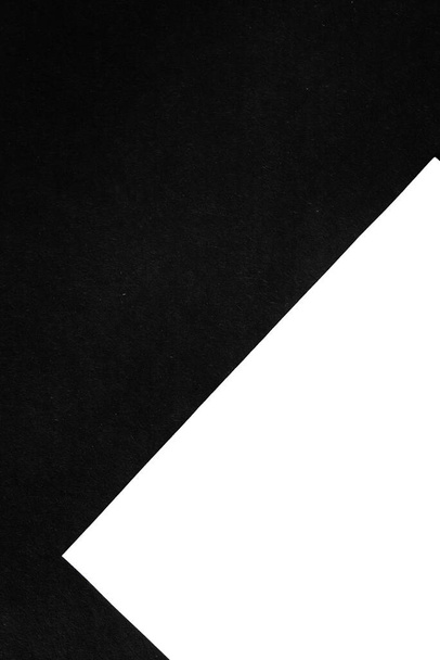 Geometric background of two paper sheets with black and white color. Texture backdrop. Concept of contrast and minimalism.S - Φωτογραφία, εικόνα