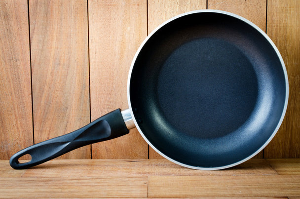 iron frying pan wooden background - Photo, Image