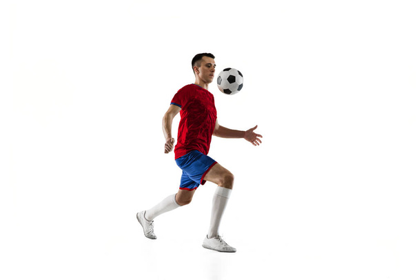 Porttrait of young soccer football player training isolated on white background. - Foto, Imagem