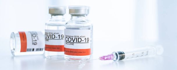 Coronavirus - 2019-nCoV or COVID-19 vaccine bottles for injection use only. Urgent vaccine research and production use in COVID-19 - Coronavirus disease. COVID-19 vaccine close up with copyspace. - 写真・画像