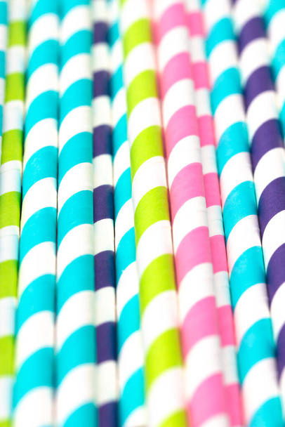 Stripped Paper Straws on a White Background - Фото, изображение