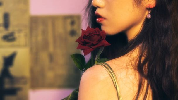 beautiful young woman with red roses in her hands - Photo, image