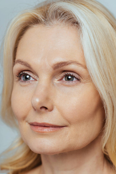 Beautiful senior woman with young and clean look, beauty shot - Pretty senior lady over 60 with perfect skin, concepts about elderly, beauty treatment and skin care - Fotoğraf, Görsel
