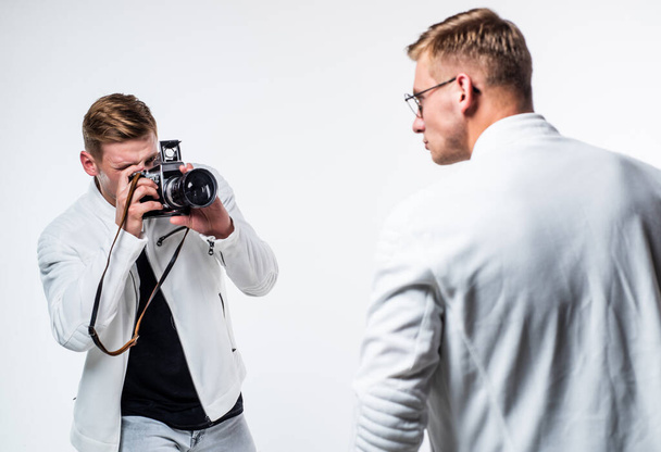 twins brother in white. photographing. beauty and fashion. similar appearance. male friendship - Valokuva, kuva