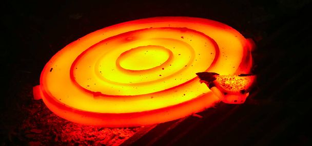 Casting steel at a steel plant. Molten metal was poured from the ladle. Metallurgical production, heavy industry, sewer manhole smelting. - Photo, Image