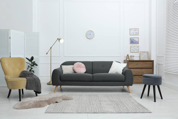Comfortable sofa in modern living room. Interior design - Фото, изображение