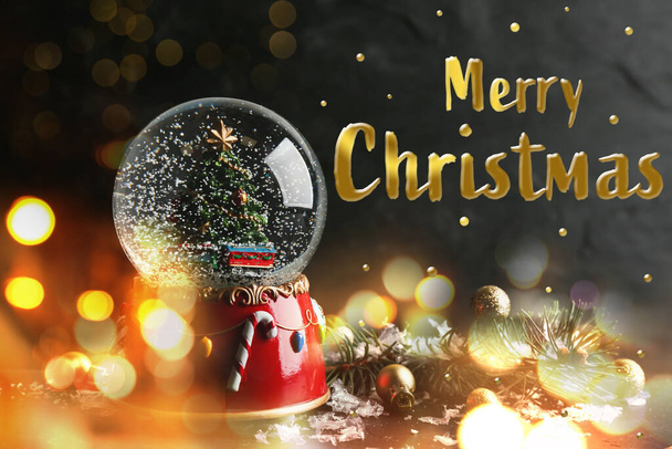 Merry Christmas. Beautiful snow globe on dark background, bokeh effect - Zdjęcie, obraz