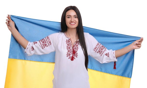 Young woman with flag of Ukraine on white background - Valokuva, kuva