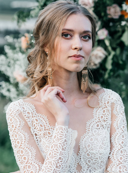 lovely beautiful young slender bride in an airy elegant white wedding dress with lace smile gentle - Fotografie, Obrázek
