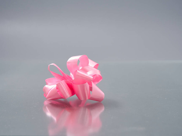 bows from a motley colorful ribbon on a gray background 2021 - 写真・画像