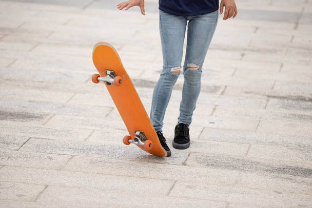 Skateboarder legs skateboarding at outdoors - Photo, Image
