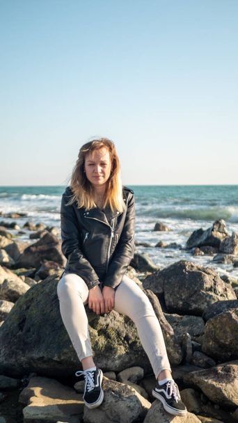 portrait of a girl on a background of the sea. copy space - Photo, Image