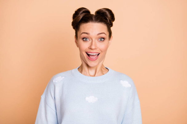 Photo of impressed nice brunette lady wear light blue sweater isolated on pastel beige color background - Foto, immagini