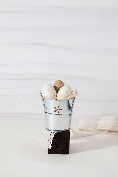 Easter beige spotted eggs in a bucket. Easter background. Copy space. - Fotografie, Obrázek