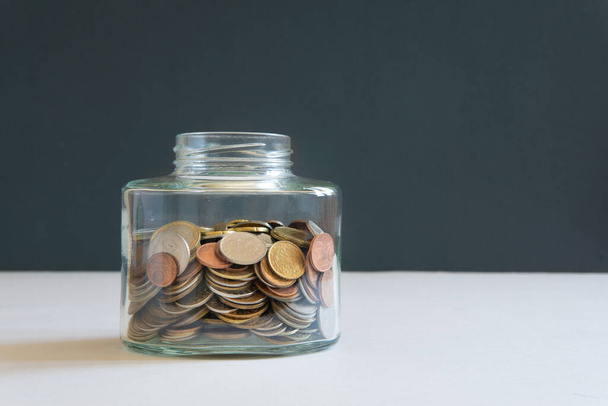 The coins are in a glass jar . Investment concept. Economic growth. Business management. Capital accumulation. - Fotoğraf, Görsel