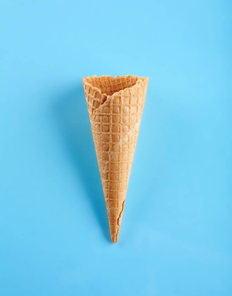 waffle ice cream cone isolated on blue background - Фото, изображение
