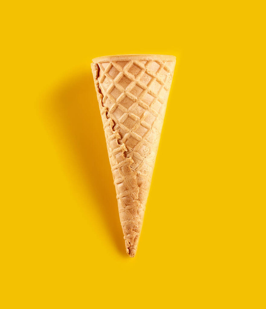 waffle ice cream cone isolated on yellow background - Photo, image