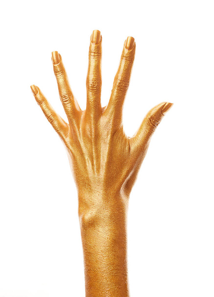 Hands in gold paint. Golden fingers. Female hand is showing numbers isolated on white background. Sign language. Hand numbers - Foto, afbeelding