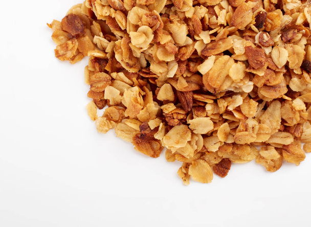 Organic homemade Granola Cereal with oats and almond. Texture oatmeal granola or muesli as background. Food concept. Healthy and wholesome food. - Photo, Image