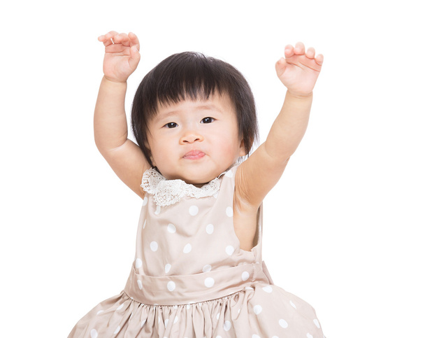 Asian baby girl raise up both hand - 写真・画像