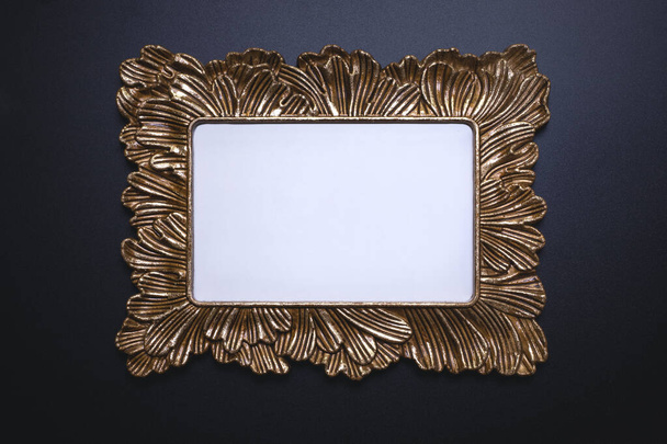Elegant background, template for text, logo or picture. Golden decorative picture frame on the black background. Free space, copy space. - Foto, immagini