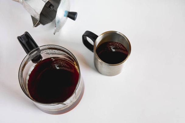 Coffee jar glass with cup and coffee maker on background. - Фото, зображення
