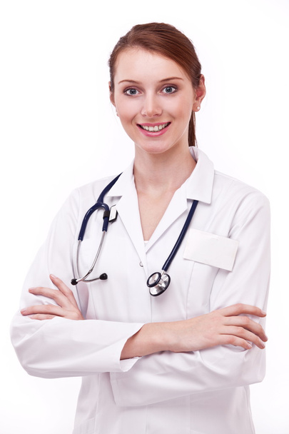 Portrait of positive young doctor (woman). Isolated on a white background. - Фото, зображення