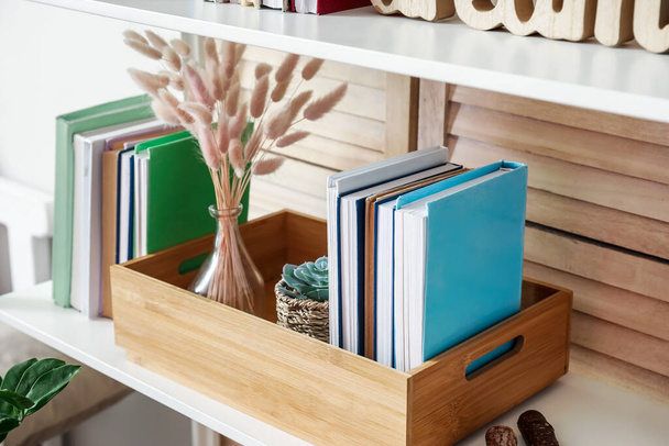 Shelf unit with books and decor in interior of room, closeup - Photo, Image