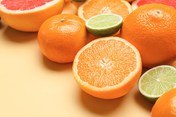 Fresh citrus fruits on color background - Photo, Image